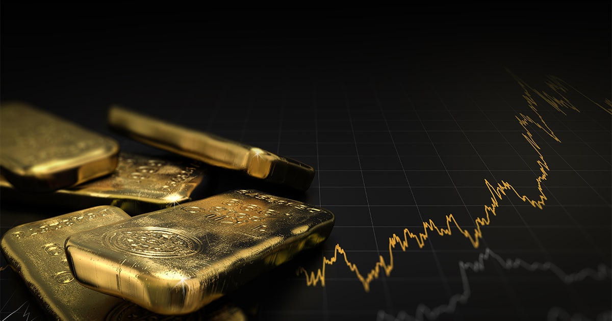 What drives the price of gold - Gold Bullion in front of a price chart